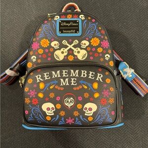 Disney Park Loungefly Black and Multicolor 'Remember Me' Backpack